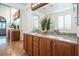 Double vanity bathroom with granite countertops and large mirror at 968 Mill Run Creek Ave, Henderson, NV 89002