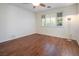 Well-lit bedroom with wood flooring and large window at 968 Mill Run Creek Ave, Henderson, NV 89002