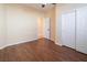 Well-lit bedroom with wood floors and a closet at 968 Mill Run Creek Ave, Henderson, NV 89002