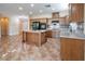 Modern kitchen with granite countertops and wood cabinets at 968 Mill Run Creek Ave, Henderson, NV 89002