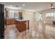 Open concept kitchen features an island and tile flooring at 968 Mill Run Creek Ave, Henderson, NV 89002