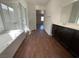 Well-lit bathroom featuring a soaking tub and a dark wood vanity at 10809 Wrigley Field Ave, Las Vegas, NV 89166