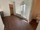 Modern bathroom featuring a soaking tub, separate glass-enclosed shower, and dark hardwood floors at 10809 Wrigley Field Ave, Las Vegas, NV 89166