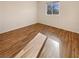 Bright bedroom with wood floors and a large window at 10809 Wrigley Field Ave, Las Vegas, NV 89166