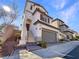 Charming two-story home featuring a two-car garage and neutral stucco exterior with lovely architectural details at 10809 Wrigley Field Ave, Las Vegas, NV 89166