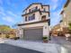 Charming two-story home featuring a two-car garage and neutral stucco exterior with lovely contrasting accents at 10809 Wrigley Field Ave, Las Vegas, NV 89166