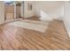Bright living room with wood-look flooring and sliding door access to outdoor patio at 10809 Wrigley Field Ave, Las Vegas, NV 89166