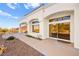 Private back patio with sliding glass doors and beautiful landscaping at 10920 Grand Haven Ave, Las Vegas, NV 89134