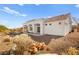 Spacious backyard with gravel landscaping and mature shrubs at 10920 Grand Haven Ave, Las Vegas, NV 89134
