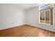 Well-lit bedroom with hardwood floors and a large window at 10920 Grand Haven Ave, Las Vegas, NV 89134