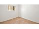 Small bedroom with tile floors and a window at 10920 Grand Haven Ave, Las Vegas, NV 89134