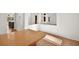 Open dining area with wood table and view to kitchen at 10920 Grand Haven Ave, Las Vegas, NV 89134