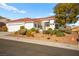 One-story house with red tile roof, landscaped yard, and two-car garage at 10920 Grand Haven Ave, Las Vegas, NV 89134