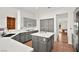 Kitchen with gray cabinets, an island, and white countertops at 10920 Grand Haven Ave, Las Vegas, NV 89134