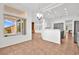 Kitchen features island, gray cabinets, and tile floor at 10920 Grand Haven Ave, Las Vegas, NV 89134