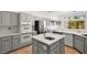 Modern kitchen with granite countertops, stainless steel appliances, and ample cabinet space for storage at 10920 Grand Haven Ave, Las Vegas, NV 89134