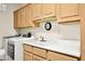 Laundry room with washer, dryer, and built-in cabinets at 10920 Grand Haven Ave, Las Vegas, NV 89134