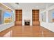 Living room featuring hardwood floors, fireplace and built-in shelves at 10920 Grand Haven Ave, Las Vegas, NV 89134
