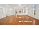Spacious living room with hardwood and tile floors, and large windows at 10920 Grand Haven Ave, Las Vegas, NV 89134