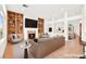 Spacious living area with built-in bookshelves, cozy fireplace, and bright, open layout; virtually staged at 10920 Grand Haven Ave, Las Vegas, NV 89134
