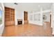 Living room with hardwood floors, fireplace, and built-in shelves at 10920 Grand Haven Ave, Las Vegas, NV 89134