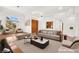 Bright living room with wood floors, high ceilings and a large picture window allowing ample natural light at 10920 Grand Haven Ave, Las Vegas, NV 89134