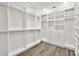 Bright and spacious walk-in closet with custom shelving and hanging rods at 10920 Grand Haven Ave, Las Vegas, NV 89134