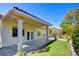 Home's covered patio extends to green backyard at 1140 Woodcastle St, Henderson, NV 89052