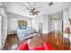 Bright main bedroom featuring hardwood floors and ceiling fan at 1140 Woodcastle St, Henderson, NV 89052