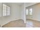 Cozy bedroom with tile flooring, and a mirrored closet at 1140 Woodcastle St, Henderson, NV 89052