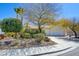 Charming single-story home with a well-manicured front yard and a three-car garage at 1140 Woodcastle St, Henderson, NV 89052