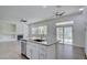 Bright open-concept kitchen featuring granite countertops, stainless steel appliances and views of the living room fireplace at 1140 Woodcastle St, Henderson, NV 89052