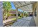 Inviting covered patio with a trellis and manicured backyard landscaping, perfect for outdoor entertaining at 1140 Woodcastle St, Henderson, NV 89052