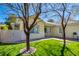 Side yard showcasing a lush lawn and paver walkway, perfect for outdoor relaxation at 1140 Woodcastle St, Henderson, NV 89052