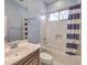 Clean bathroom with shower/tub combo and striped curtain at 12 Fallows Fire Ct, Henderson, NV 89052