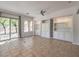 Bright living room with built-in shelving and tile flooring at 12 Fallows Fire Ct, Henderson, NV 89052