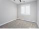 Spacious bedroom with neutral carpeting and plantation shutters at 1348 Mariposa Way, Mesquite, NV 89027