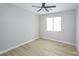 Bright bedroom featuring light grey walls and wood-look flooring at 1348 Mariposa Way, Mesquite, NV 89027