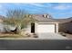 One-story home with attached garage, desert landscaping, and neutral color palette at 1348 Mariposa Way, Mesquite, NV 89027