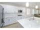 Modern kitchen with white cabinets, quartz countertops, and stainless steel appliances at 1348 Mariposa Way, Mesquite, NV 89027