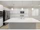 Modern kitchen with white cabinets, large island, and stainless steel appliances at 1348 Mariposa Way, Mesquite, NV 89027