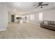 Open concept living area with kitchen and light colored flooring at 1348 Mariposa Way, Mesquite, NV 89027