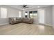 Spacious living room with L-shaped sofa and wood-look flooring at 1348 Mariposa Way, Mesquite, NV 89027