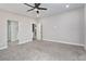 Spacious main bedroom with neutral carpet and access to bathroom at 1348 Mariposa Way, Mesquite, NV 89027