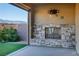 Covered patio with fireplace and mountain views at 1348 Mariposa Way, Mesquite, NV 89027