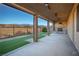Covered patio with mountain views, fireplace and fans at 1348 Mariposa Way, Mesquite, NV 89027