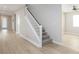 Modern staircase with white railings and carpeted steps at 1348 Mariposa Way, Mesquite, NV 89027
