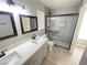 Updated bathroom with double vanity and walk-in shower at 1551 Leatherleaf Dr, Las Vegas, NV 89123