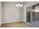 Bright dining room with laminate flooring and sliding glass doors at 1664 Britannia Ave, Henderson, NV 89014