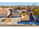 Two-story house with a pool and landscaped yard at 1736 Hill Canyon Ln, Las Vegas, NV 89144